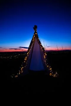 Teepee during dark sunset in quarry Hady Brno with view on city centre. Stock-Fotos