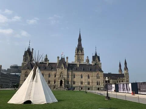 Teepee with Regal Building in Background 库存照片