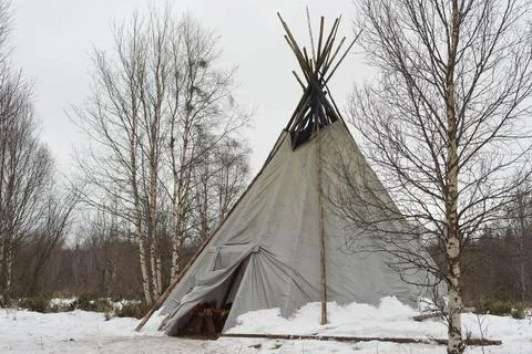 Teepee in the snow background Stock Photos