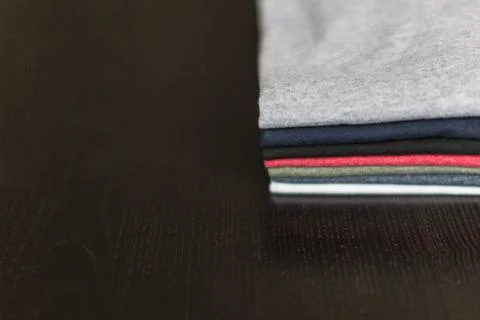 Tees-on-wood-table   Stock Photos