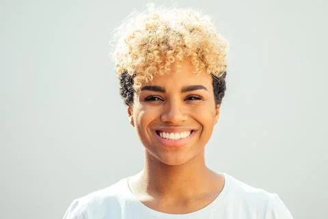 Teeth alignment and whitening concept. Happy brazilian hispanic girl showing her Stock Photos