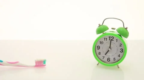 Teeth brush and alarm clock Stock Footage 67646949