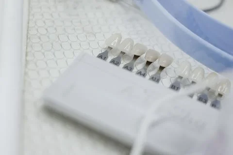 Teeth on chromascope scale close up view .  teeth whitening concept Stock Photos