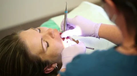 Teeth Cleaning Over the Dentist Shoulder Video stock 57754344