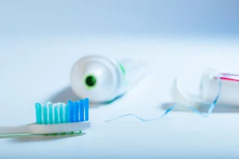 Teeth cleaning set on blue background Stock Photos