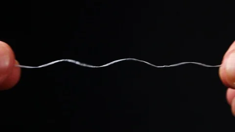 Teeth cleaning thread. hands holding teeth cleaning thread Stock Footage 87217138