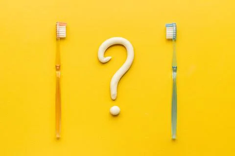 Teeth hygiene concept. Toothbrushes with toothpaste, top view Stock Photos