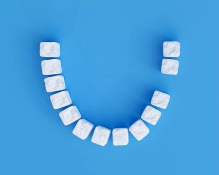 Teeth made of sugar cubes on blue background, one tooth missing. Sweet tooth Stock Illustration
