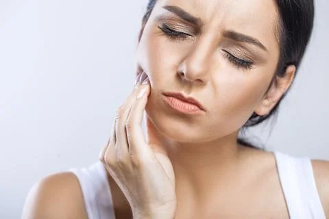 Teeth Problem. Woman Feeling Tooth Pain. Closeup Of Beautiful Sad Girl Suffering Stock Photos