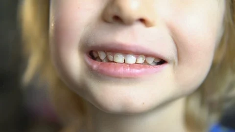 Teeth with a touch. super slow shooting. Stock Footage 81884946