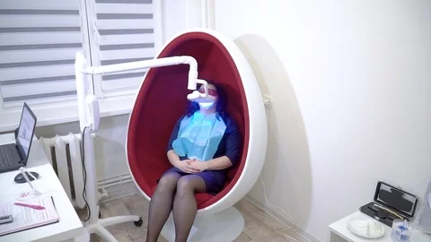 Teeth whitening procedure with ultraviolet light UV lamp Stock Footage 106204801