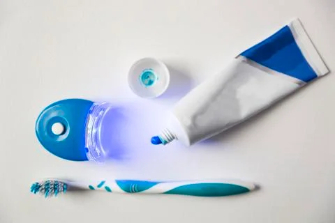 Teeth whitening set including toothpaste, toothbrush and LED light Stock Photos