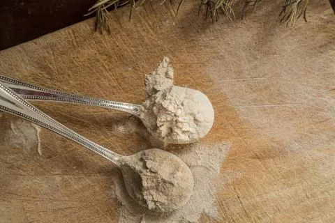 Teff flour on two spoons Stock Photos