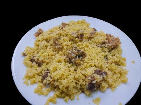 Tehari - South Asian beef Biriyani made with mustard oil with a black backgro Stock Photos