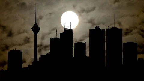 Tehran Cityscape By Night with Dark Atmosphere, Fog, Smoke, and Full Moon, Iran Stock Footage 277841124
