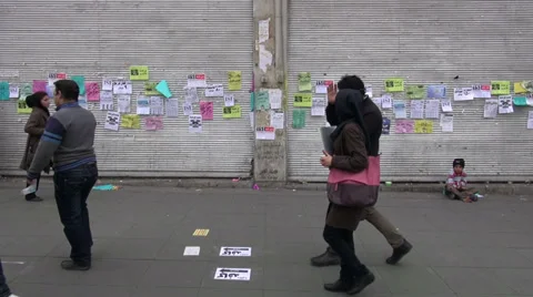 Tehran Iran closed shops young beggar pedestrians streets sanctions Video stock 33941895