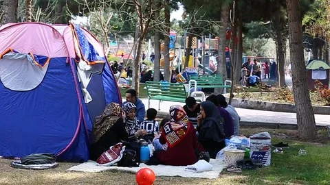 Tehran, Iran - March 27, 2018: Iranian travelers living in tents on the beach at Video stock 106942113