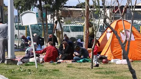 Tehran, Iran - March 27, 2018: Iranian travelers living in tents on the beach at Stock-Footage 106942231