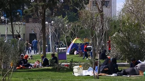Tehran, Iran - March 27, 2018: Iranian travelers living in tents on the beach at Stock-Footage 106942311