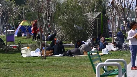 Tehran, Iran - March 27, 2018: Iranian travelers living in tents on the beach at Stock Footage 106942329