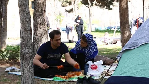 Tehran, Iran - March 27, 2018: Iranian travelers living in tents on the beach at 動画素材 106942810