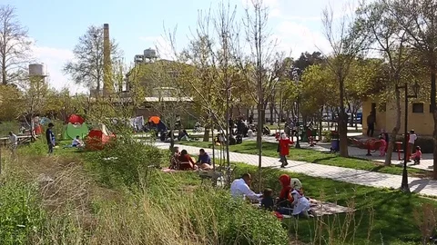 Tehran, Iran - March 27, 2018: Iranian travelers living in tents on the beach at Stock-Footage 106943014