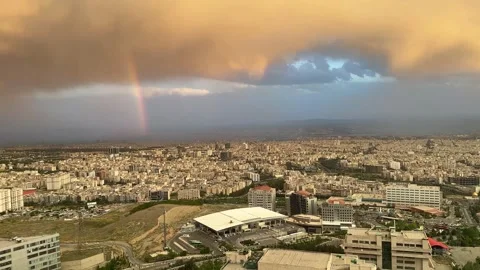 Tehran, rainbow, cloudy sky, panoramic, city rotation Stock Footage 297551946
