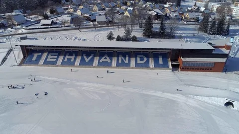 Tehvandi ski stadium stands during snowy winter with cross-country skiers Stock Footage 88783288