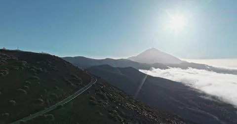 Teide volcano road winding through mountains overlooking clouds Stock Photos