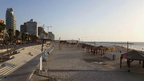 Tel-Aviv beach and promenade, hotels and cranes, distant kite surfers, pavilions Video stock 80707652