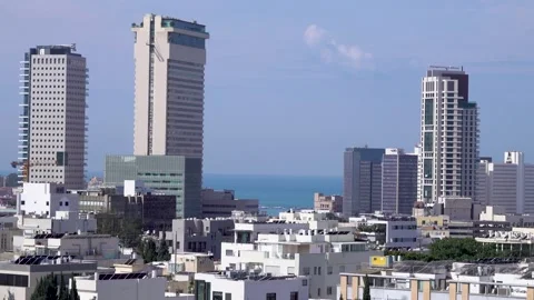 Tel aviv, Fast moving clouds, Tel Aviv buildings Stockbeeldmateriaal 196971159