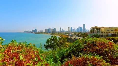 Tel Aviv Mediterranean sea beach with city skyline Stock Footage 73607099