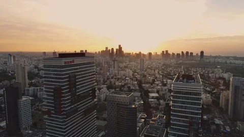 Tel aviv skyline at orange sunset. Horizon view of towers and buildings towards Stock Footage 123661944