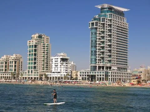 Tel Aviv surfer with hotels background Stock Photos