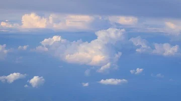 Tele view above the clouds from airplane Stock Footage 86097178