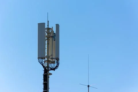 Telecom Base Station Antenna with Rooftop Aerial Stock Photos