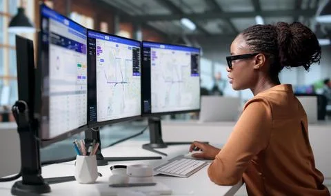 Telecom Engineer Carefully Plans Fiber Network Routes Using Mapping Software. Foto stock