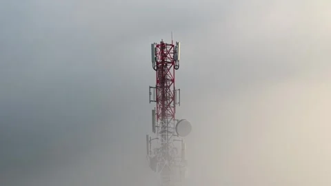 Telecom tower emerges from dense fog Vidéo 339825071