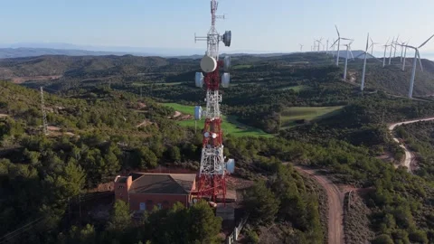 Telecom Tower on Mountain with Wind Turbines – Aerial 4K Drone Shot Stock-Footage 304147987