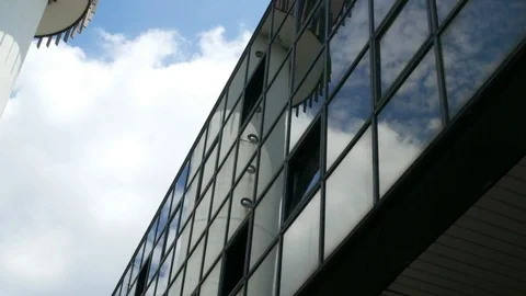 Telecom Tower reflected in office windows with clouds in background Stock Footage 90758110
