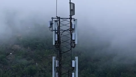 Telecom Tower Rising Through Fog Above Norwegian Countryside in Flam Stock Footage 341537783