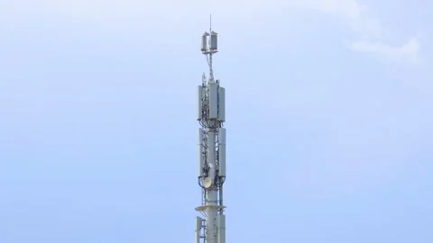 Telecommunication cell tower with 5g antennas standing near Hendaye coastal area Stock Footage 346294375