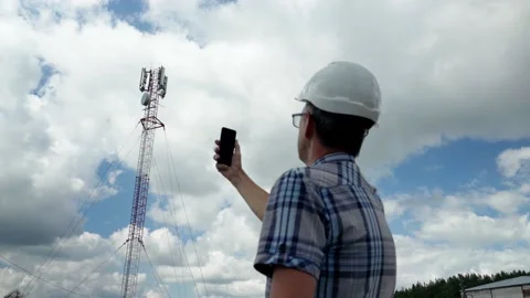 The telecommunication engineer while checking the signal with the technician who Stock Footage 156846260