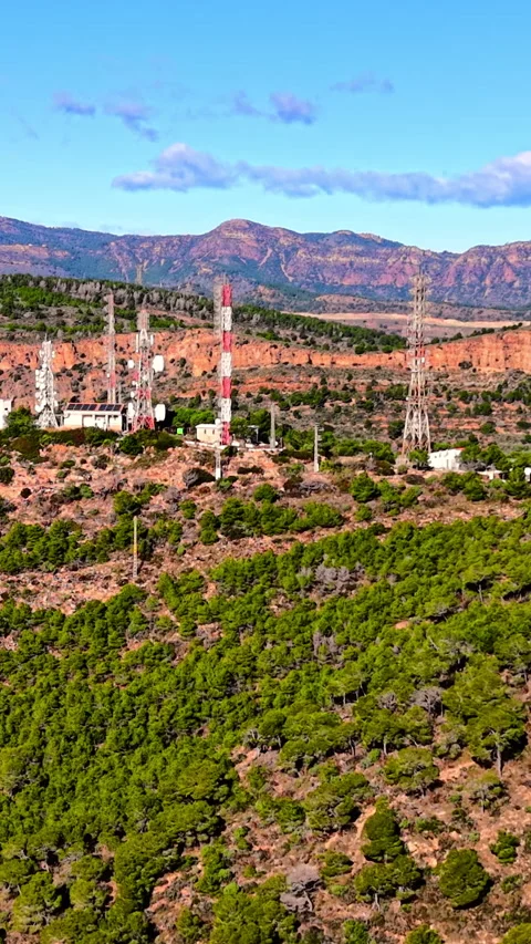 Telecommunication masts on pine forested ridge, Valencia, Spain Vertical video. Stock Footage 346842088