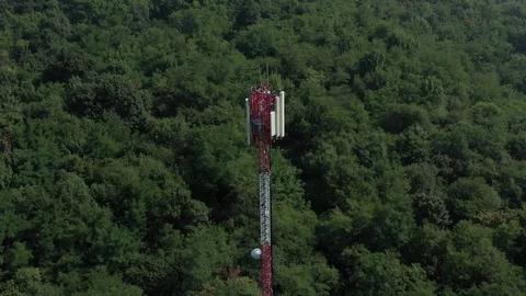 Telecommunication network repeater and mobile base transceiver 4K aerial Stock Footage 115644471