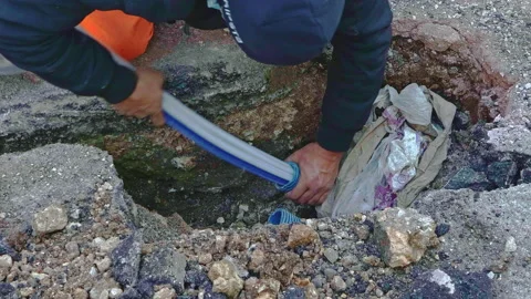 Telecommunication technician proceeds with the cabling of fibre optic cables. Video stock 281642469