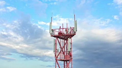 Telecommunication technology antennae on the telecom tower against blue sky Stock Footage 159932080