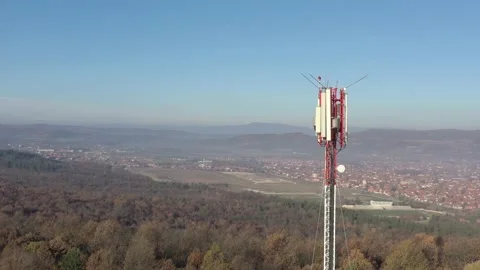 Telecommunication tower above endless valley 4K drone footage Stock Footage 99791774