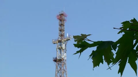 Telecommunication tower against the blue sky Stock Footage 51973377