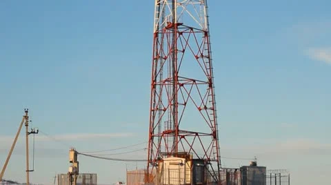 Telecommunication tower with antennas of cellular communication in the sky Stock Footage